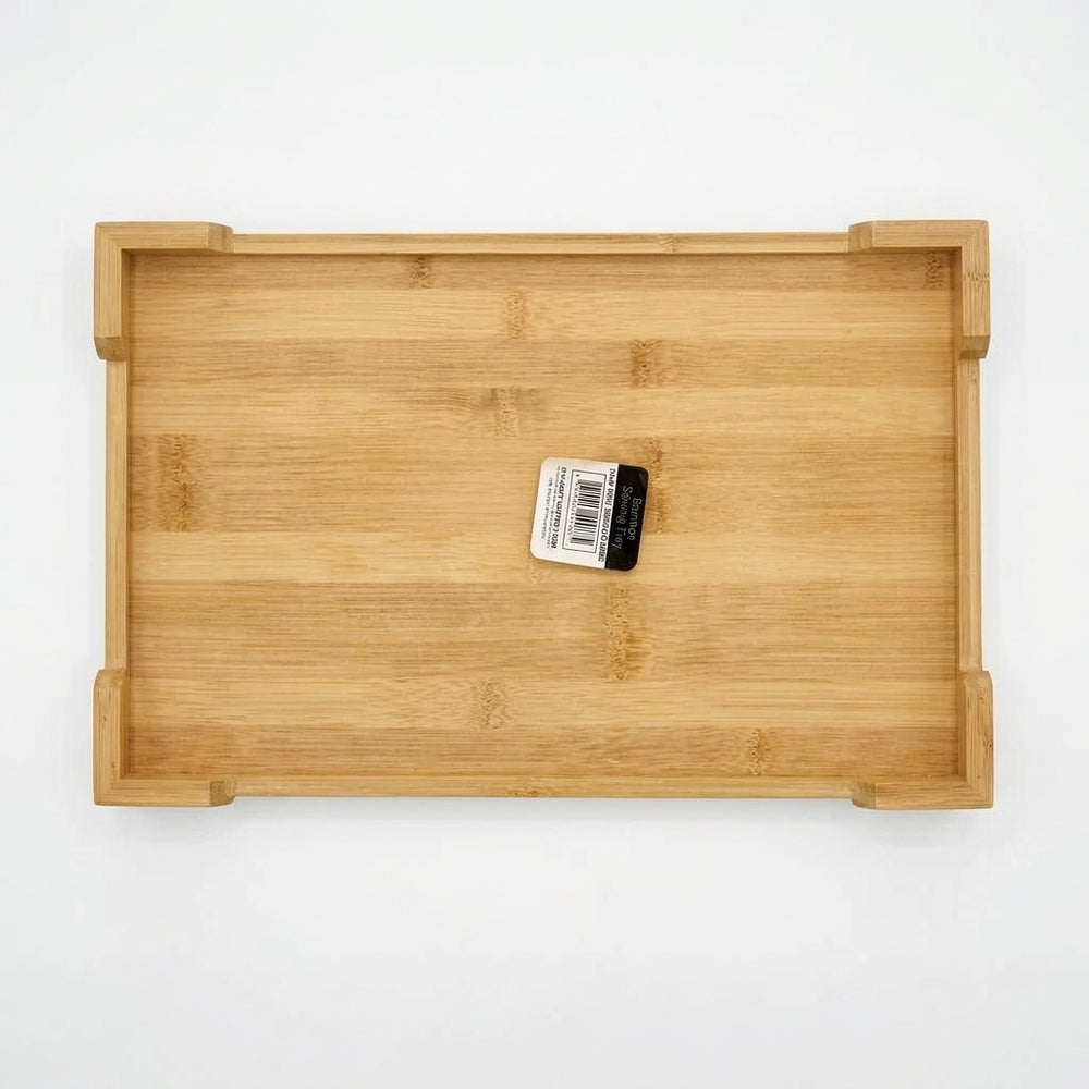 Medium bamboo kitchen tray with handles displayed in store