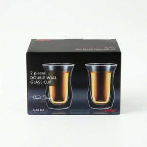 Front view of Soho double wall glass cup set packaging with two cups filled