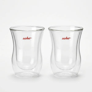 Two Soho double wall glass cups on a black surface