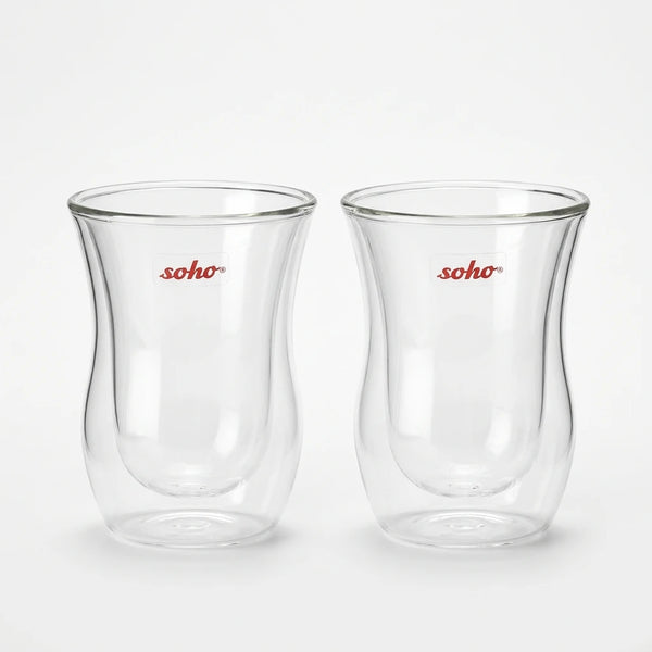 Two Soho double wall glass cups on a black surface