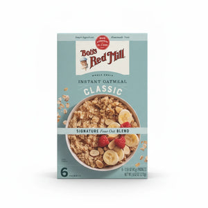 A box of Bob's Red Mill Gluten-Free Instant Oatmeal Classic, featuring a bowl of oatmeal with bananas and raspberries, on a clean white background.