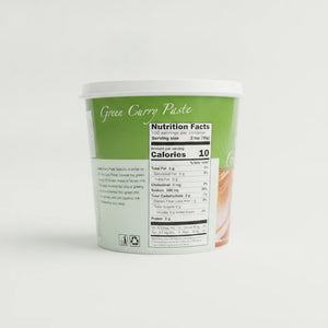 A high-resolution product photo of Mae Ploy Green Curry Paste, a 2lb container of authentic Thai flavor, centered on a clean white studio background with soft lighting and shadow.